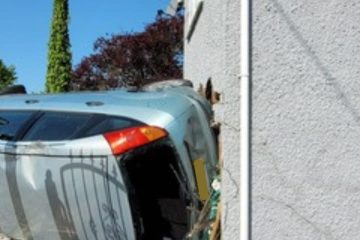 Flipped silver car