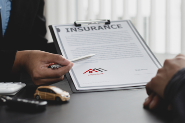 Insurance calculations, clipboard and pen