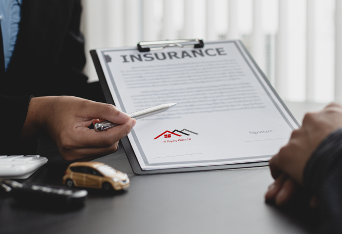 Insurance calculations, clipboard and pen